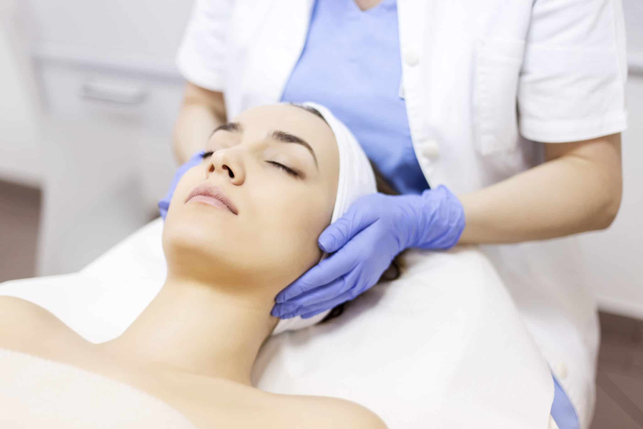 Woman relaxing at medical spa, about to receive chemical peel treatment