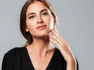 Young adult woman in black clothes dress portrait.