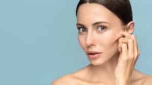 Woman,Without,Makeup,Touching,Cheeks,After,Glycolic,Acid,Peel,,Has