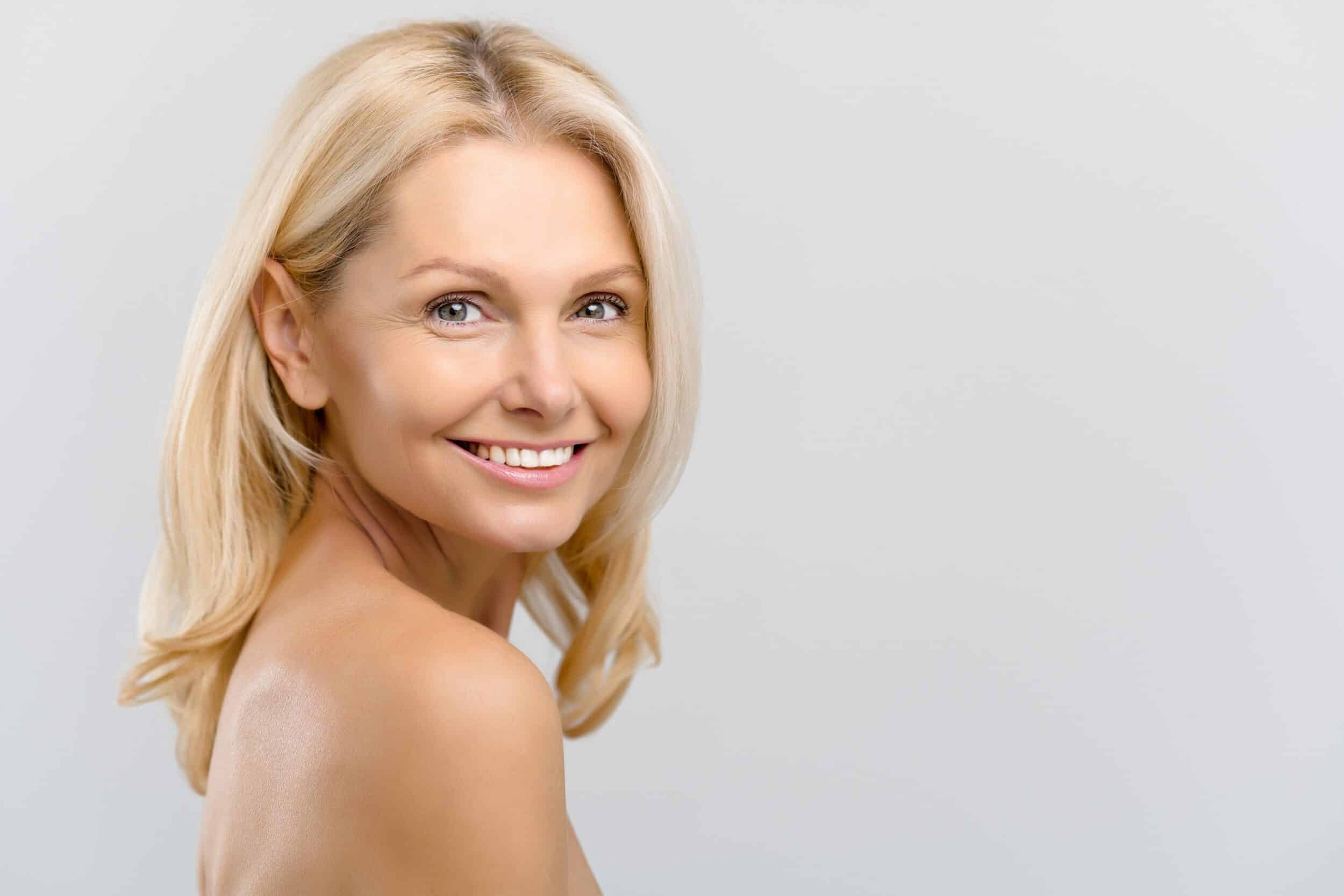 A woman smiling and showing results of BOTOX in Mt. Pleasant