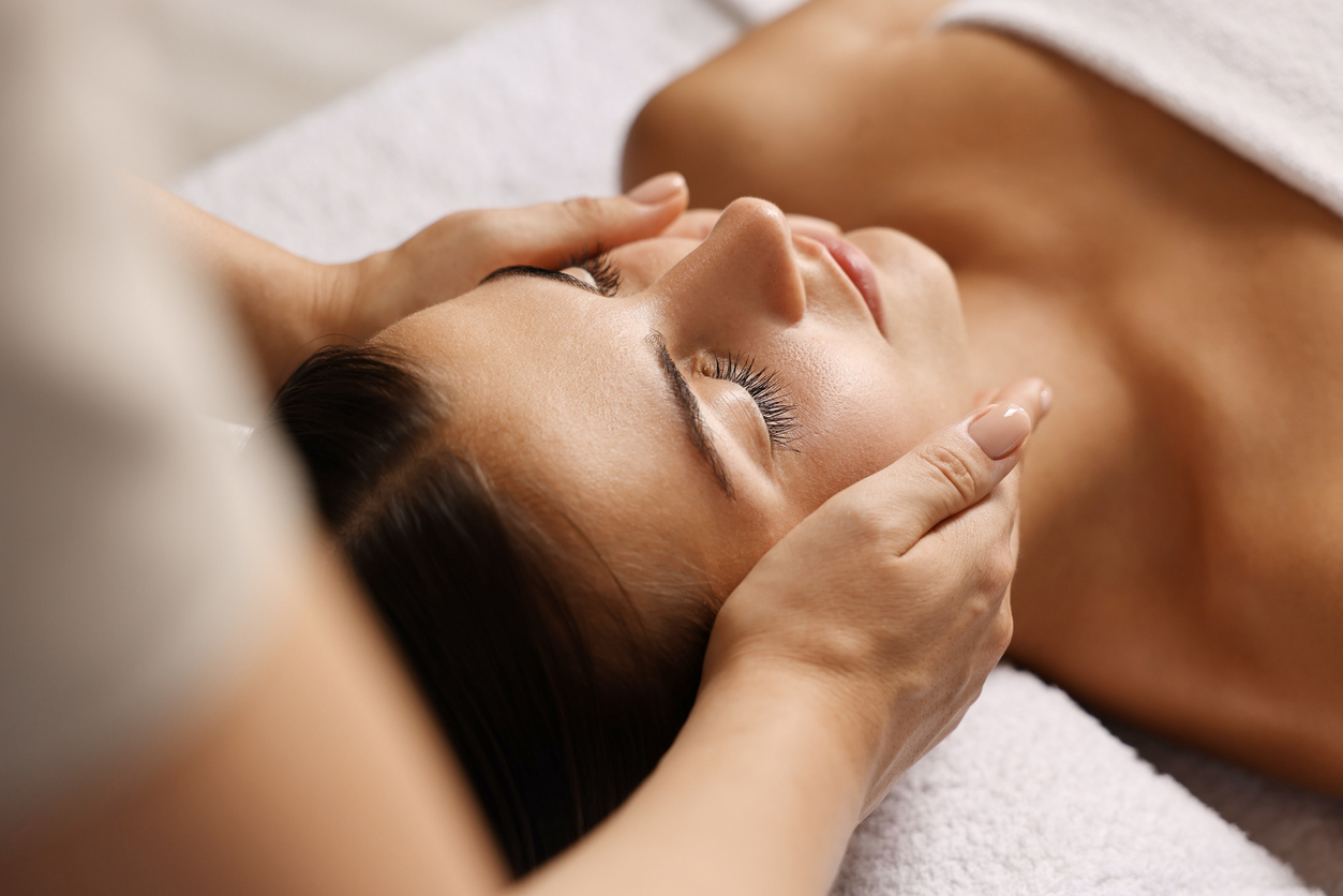 Woman receiving a facial skin rejuvenation treatment as part of a personalized skincare plan.